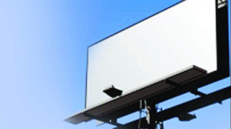 A senior GHMC official admitted that there is no curb on illegal hoardings and said the city must have an approved policy for outdoor advertising. A senior GHMC official admitted that there is no curb on illegal hoardings and said the city must have an approved policy for outdoor advertising.