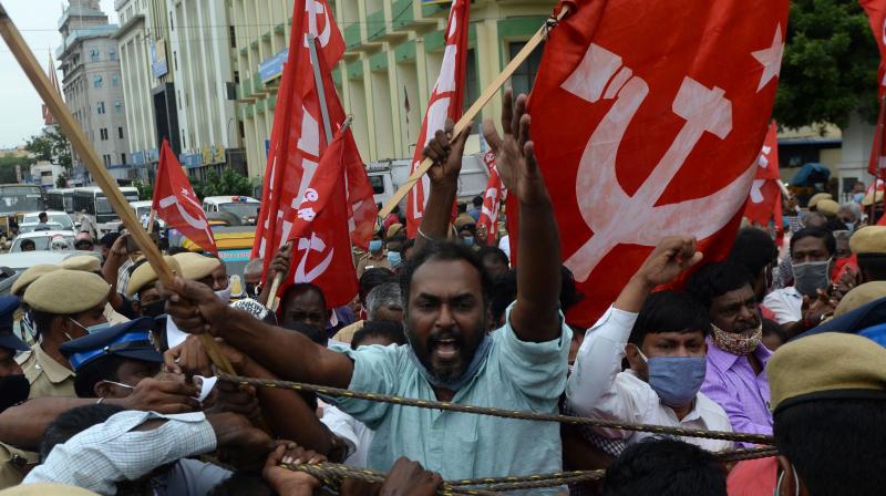 A member of the Communist Party of India protests against the government's new legislations. (AFP) A member of the Communist Party of India protests against the government's new legislations. (AFP)
