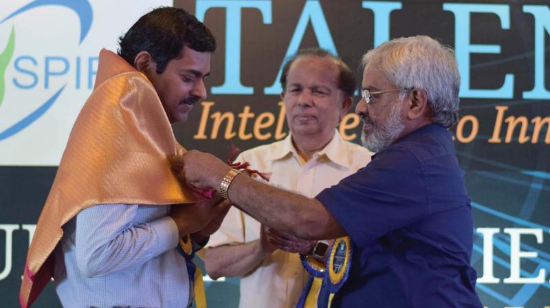 M. Chandradathan, scientific adviser to chief minister, felicitates Dr S. K. Satheesh, chairman, Divecha Centre for Climate Change, Indian Institute of Science, Bengaluru, during the panel discussion on ‘Science Education in the Digital Age’ in Thiruvananthapuram on Friday. G. Madhavan Nair, former ISRO chairman, is also seen. (A. V. MUZAFAR) M. Chandradathan, scientific adviser to chief minister, felicitates Dr S. K. Satheesh, chairman, Divecha Centre for Climate Change, Indian Institute of Science, Bengaluru, during the panel discussion on ‘Science Education in the Digital Age’ in Thiruvananthapuram on Friday. G. Madhavan Nair, former ISRO chairman, is also seen. (A. V. MUZAFAR)