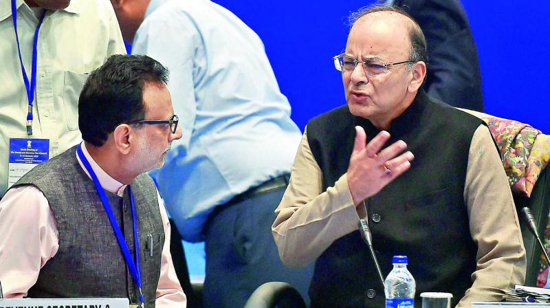 Union finance minister Arun Jaitley and revenue secretary Hasmukh Adhia at the 6th Goods and Services Tax Council meeting in New Delhi on Sunday. (Photo: AP) Union finance minister Arun Jaitley and revenue secretary Hasmukh Adhia at the 6th Goods and Services Tax Council meeting in New Delhi on Sunday. (Photo: AP)