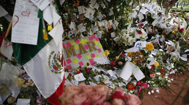 It is part of a process of grieving, paying homage to the victims and the first responders who toiled for days to rescue survivors. (Photo: AP) It is part of a process of grieving, paying homage to the victims and the first responders who toiled for days to rescue survivors. (Photo: AP)