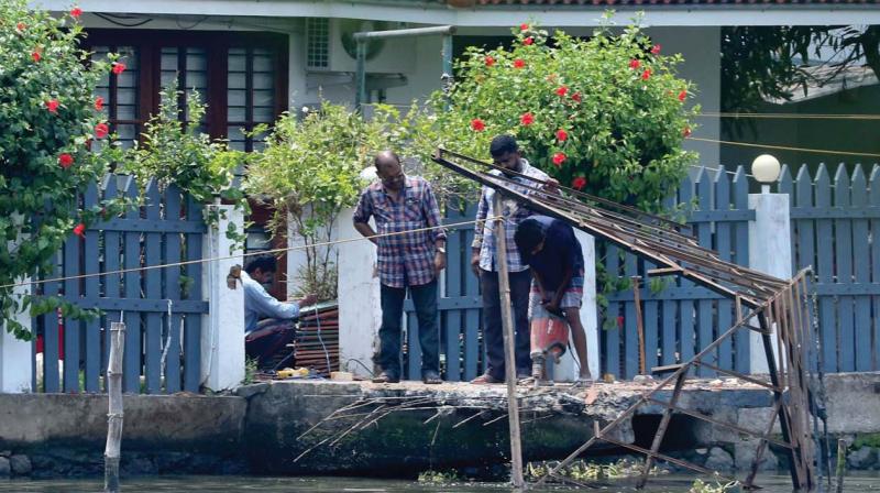 Kochi corporation workers demolish Jayasurya’s boat jetty on encroached land on Wednesday.(Photo: DC) Kochi corporation workers demolish Jayasurya’s boat jetty on encroached land on Wednesday.(Photo: DC)