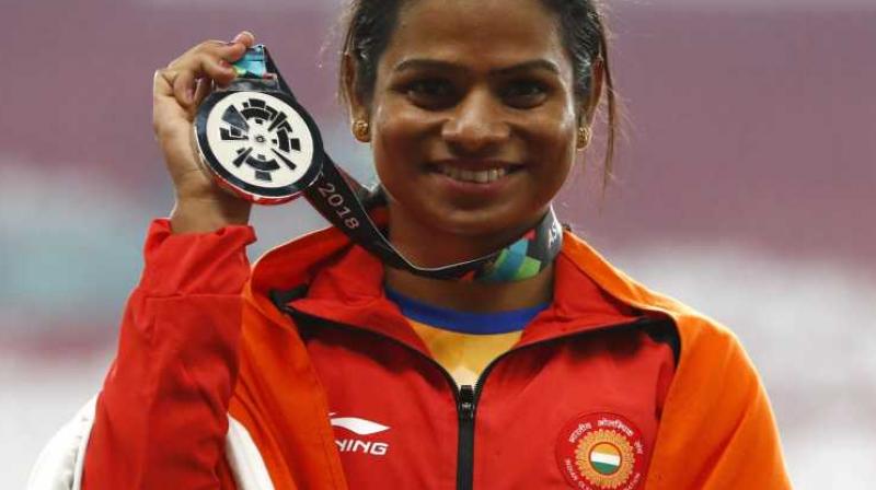 Indian ace runner Dutee Chand won her second gold in the Khelo India University Games after bagging the top spot in 200m final here on Sunday. (Photo:AFP) Indian ace runner Dutee Chand won her second gold in the Khelo India University Games after bagging the top spot in 200m final here on Sunday. (Photo:AFP)