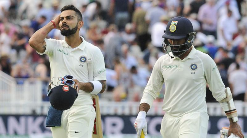 Virat Kohli, whose superb first-innings 149 was the star batsman's maiden Test century in England, was 43 not out and Dinesh Karthik unbeaten on 18 at stumps on Day three of what has been a riveting first Test. (Photo: AP) Virat Kohli, whose superb first-innings 149 was the star batsman's maiden Test century in England, was 43 not out and Dinesh Karthik unbeaten on 18 at stumps on Day three of what has been a riveting first Test. (Photo: AP)