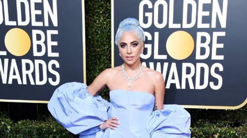 Pop superstar Lady Gaga, dressed in lavender, leading a trend for old school glamor. (Photo credit: Twitter) Pop superstar Lady Gaga, dressed in lavender, leading a trend for old school glamor. (Photo credit: Twitter)