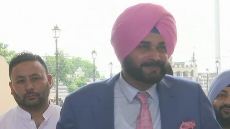 Responding to a question at 'Soch Se Soch Ki Ladai' event organised by Youth Congress in Ajmer city of Rajasthan, Sidhu said sportsmen and artists break barrier and bring people closer. (Photo: Twitter | @ANI) Responding to a question at 'Soch Se Soch Ki Ladai' event organised by Youth Congress in Ajmer city of Rajasthan, Sidhu said sportsmen and artists break barrier and bring people closer. (Photo: Twitter | @ANI)