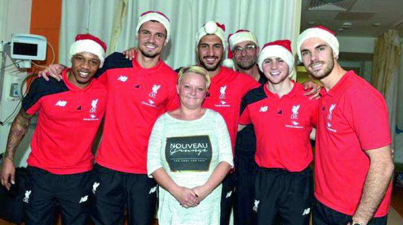 Jurgen Klopp and his Liverpool players took some time out of their busy club duties to provide some festive cheer to those in need. Jurgen Klopp and his Liverpool players took some time out of their busy club duties to provide some festive cheer to those in need.