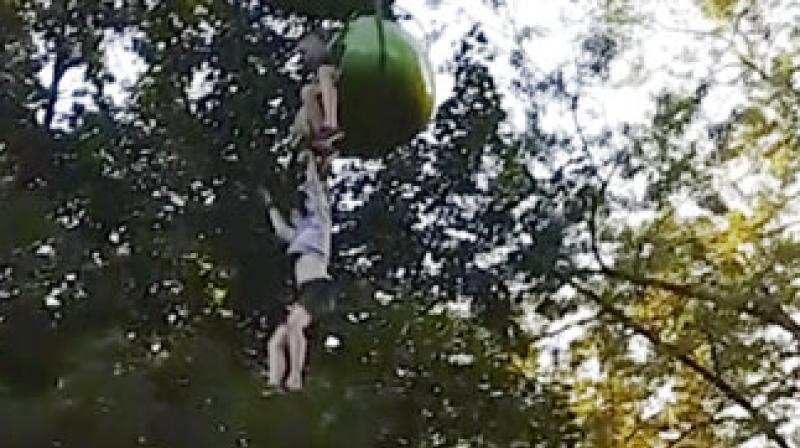 In this June 24, 2017, image made from a video provided by Leeann Winchell, a 14-year-old girl falls from an amusement park ride at Six Flags Great Escape Amusement Park in Queensbury, N.Y. (Photo: AP) In this June 24, 2017, image made from a video provided by Leeann Winchell, a 14-year-old girl falls from an amusement park ride at Six Flags Great Escape Amusement Park in Queensbury, N.Y. (Photo: AP)