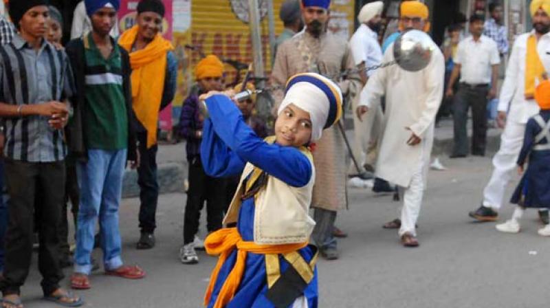 The Sikh youths hailing from Kalgidhar Dashmesh Jatha and other Gatka Jathas displayed their exhilarating 'Gatka'' skills (Sikh martial art forms) by performing extraordinary stunts with their blunt weapons, kirpans and swords. The Sikh youths hailing from Kalgidhar Dashmesh Jatha and other Gatka Jathas displayed their exhilarating 'Gatka'' skills (Sikh martial art forms) by performing extraordinary stunts with their blunt weapons, kirpans and swords.