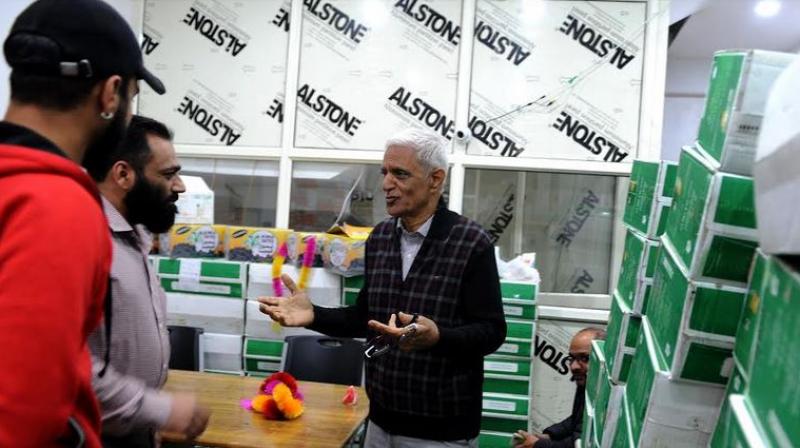 Roshan Lal Mawa interacts with his customers at his recently reopened shop in Srinagar. (Photo: HU) Roshan Lal Mawa interacts with his customers at his recently reopened shop in Srinagar. (Photo: HU)