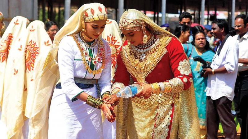 Ajmina( dressed up as Manavatti ) providing first aid to her friend who was injured during their oppana performance at main venue- Police ground. Ajmina( dressed up as Manavatti ) providing first aid to her friend who was injured during their oppana performance at main venue- Police ground.