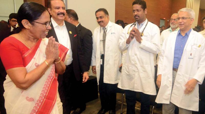 Health minister K.K. Shailaja greets doctors of Aster Medcity at a function to declare Ernakulam Nipah-free district in Kochi on Tuesday. (Photo: DC) Health minister K.K. Shailaja greets doctors of Aster Medcity at a function to declare Ernakulam Nipah-free district in Kochi on Tuesday. (Photo: DC)