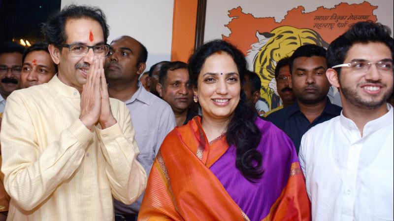 Shiv Sena President Uddhav Thackeray (L) along with his wife Rashmi and son Aditya. (Photo: PTI) Shiv Sena President Uddhav Thackeray (L) along with his wife Rashmi and son Aditya. (Photo: PTI)