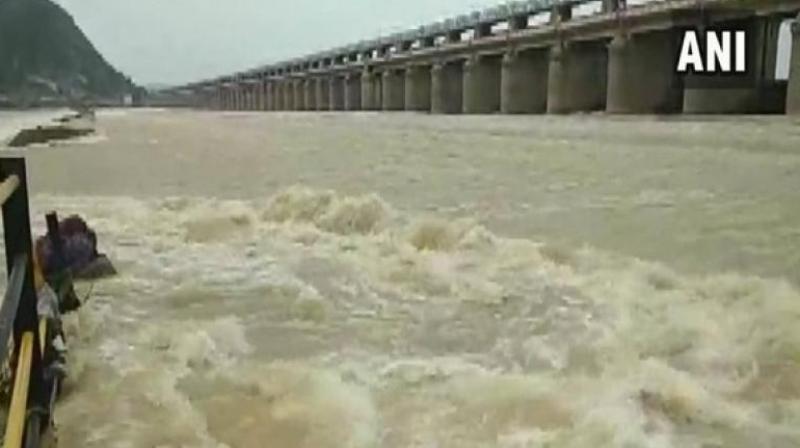 The authorities concerned said that when the discharge of water will be about six lakh cusecs, the water-level may rise in the river and reach up to the brim of flood banks. (Photo: ANI) The authorities concerned said that when the discharge of water will be about six lakh cusecs, the water-level may rise in the river and reach up to the brim of flood banks. (Photo: ANI)