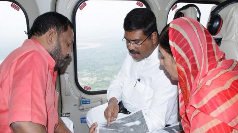 Two BJP MPs Basant Panda and SK Singh Deo from Kalahandi and Balangir, respectively, joined Pradhan in his aerial survey. (Photo: ANI) Two BJP MPs Basant Panda and SK Singh Deo from Kalahandi and Balangir, respectively, joined Pradhan in his aerial survey. (Photo: ANI)
