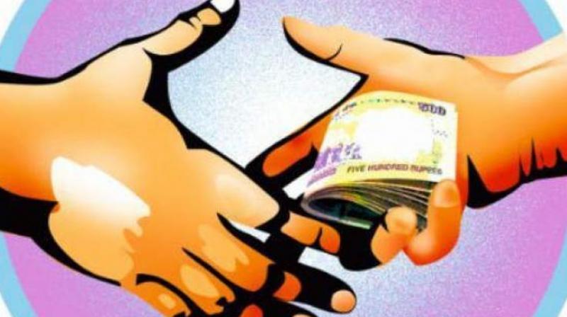 The official was caught for accepting bribe in return for a favour of clearing the complainant’s salary arrears and to send his last pay certificate (LPC) to Nizamabad. (Representational Image) The official was caught for accepting bribe in return for a favour of clearing the complainant’s salary arrears and to send his last pay certificate (LPC) to Nizamabad. (Representational Image)