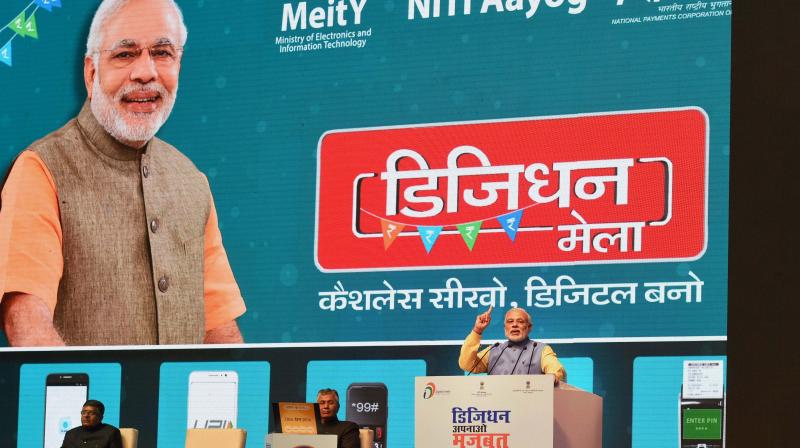 Prime Minister Narendra Modi addressing at the launch of a new mobile app 'BHIM' to encourage e-transactions during the ''Digital Mela'' at Talkatora Stadium in New Delhi. (Photo: PTI) Prime Minister Narendra Modi addressing at the launch of a new mobile app 'BHIM' to encourage e-transactions during the ''Digital Mela'' at Talkatora Stadium in New Delhi. (Photo: PTI)