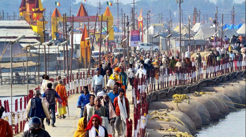Pilgrims arrive to take holy dip in river Ganges on the eve of Makar Sankranti festival during the annual Magh Mela in Allahabad. (Photo: PTI) Pilgrims arrive to take holy dip in river Ganges on the eve of Makar Sankranti festival during the annual Magh Mela in Allahabad. (Photo: PTI)