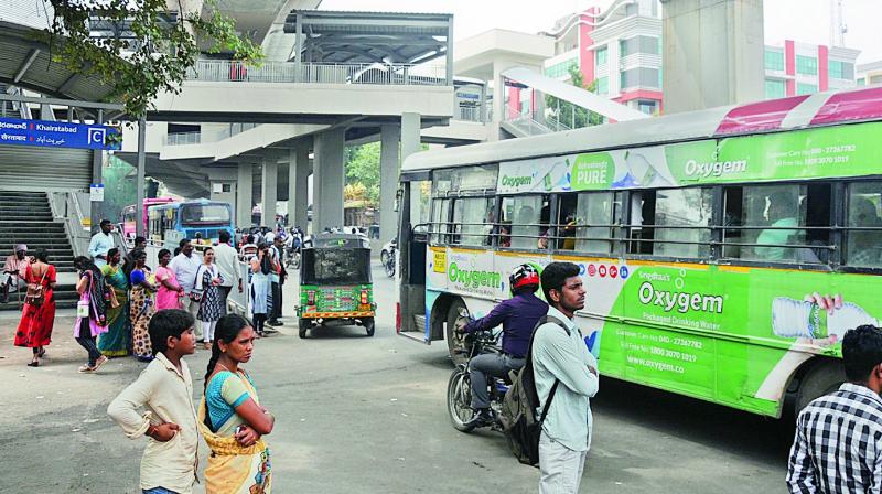 Commuters wait for a bus at the Khairatabad Metro station. (Photos:DEEPAK DESHPANDE) Commuters wait for a bus at the Khairatabad Metro station. (Photos:DEEPAK DESHPANDE)