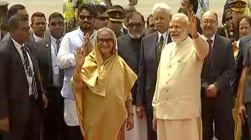 Prime Minister Narendra Modi receives his Bangladeshi counterpart Sheikh Hasina at Delhi airport. (Photo: ANI) Prime Minister Narendra Modi receives his Bangladeshi counterpart Sheikh Hasina at Delhi airport. (Photo: ANI)