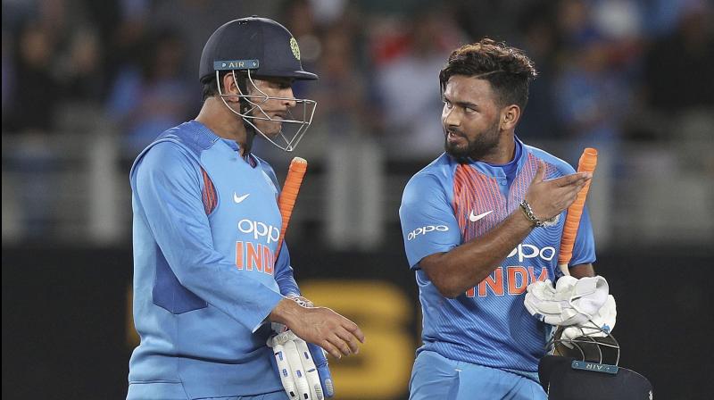 Rishabh Pant (R) listens keenly to MS Dhoni on their walk back to the pavillion after winning the Twenty/20 game against New Zealand at Eden Park in Auckland, New Zealand. AP Photo Rishabh Pant (R) listens keenly to MS Dhoni on their walk back to the pavillion after winning the Twenty/20 game against New Zealand at Eden Park in Auckland, New Zealand. AP Photo