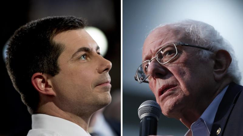 Democratic presidential candidate Pete Buttigieg (left) and Bernie Sanders remained locked in a tight race in the Iowa Democratic Party caucus. (AP)