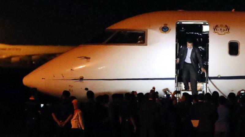 One of the Malaysians who was stranded in Pyongyang walks down from a plane after arriving at Kuala Lumpur International airport (Photo: AP) One of the Malaysians who was stranded in Pyongyang walks down from a plane after arriving at Kuala Lumpur International airport (Photo: AP)