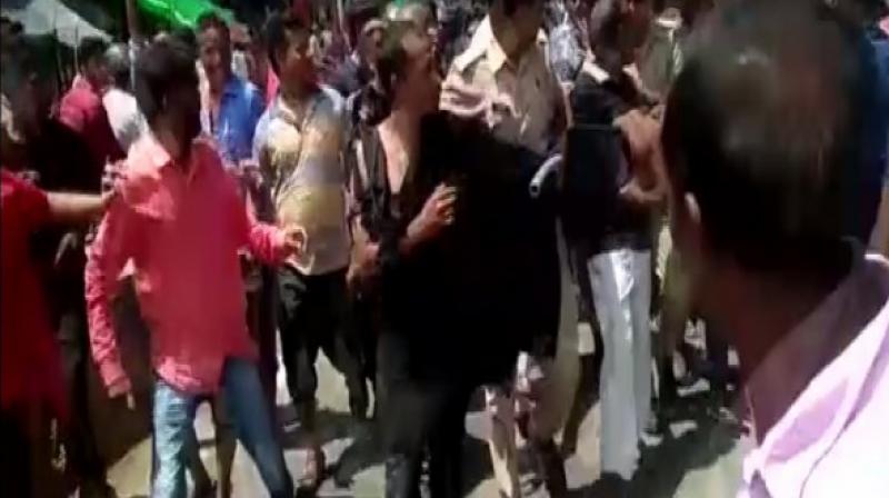 A man was allegedly thrashed by a mob over suspicion of being a child-lifter in Kanpur's Om Purva area in Uttar Pradesh. (Photo: ANI) A man was allegedly thrashed by a mob over suspicion of being a child-lifter in Kanpur's Om Purva area in Uttar Pradesh. (Photo: ANI)