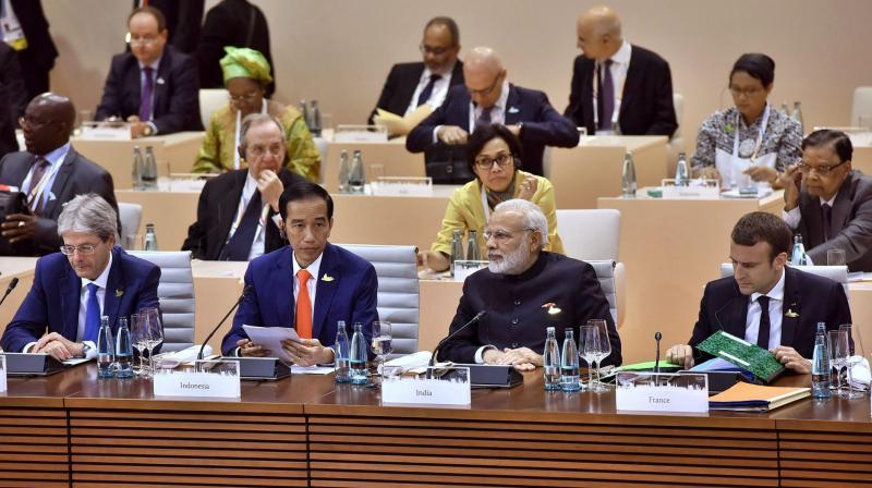 Prime Minister Narendra Modi at the plenary session of the G-20 Summit in Hamburg, Germany on Friday. (Photo: PTI) Prime Minister Narendra Modi at the plenary session of the G-20 Summit in Hamburg, Germany on Friday. (Photo: PTI)