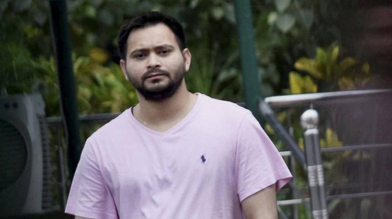 Bihar deputy CM Tejashwi Yadav at RJD Chief Lalu Prasad’s residence as CBI?conducts raids at 10, Circular Road in Patna on Friday. (Photo: PTI) Bihar deputy CM Tejashwi Yadav at RJD Chief Lalu Prasad’s residence as CBI?conducts raids at 10, Circular Road in Patna on Friday. (Photo: PTI)