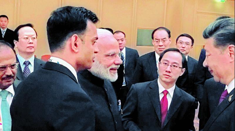 Prime Minister Narendra Modi and Chinese President Xi Jinping exchange greetings in Hamburg on Friday. (Photo: PTI) Prime Minister Narendra Modi and Chinese President Xi Jinping exchange greetings in Hamburg on Friday. (Photo: PTI)
