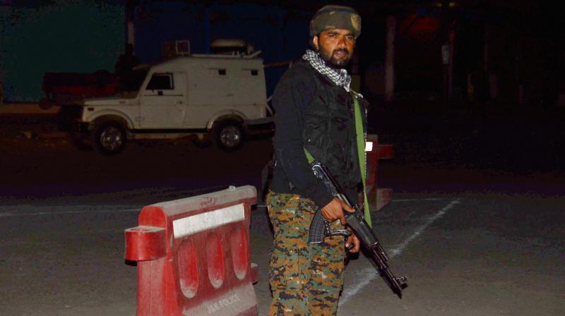 Security person stand guard after militants opened fire on the Amarnath Yatra in which some pilgrims were killed many injured in Anantnag in Jammu and Kashmir on Monday. (Photo: PTI) Security person stand guard after militants opened fire on the Amarnath Yatra in which some pilgrims were killed many injured in Anantnag in Jammu and Kashmir on Monday. (Photo: PTI)