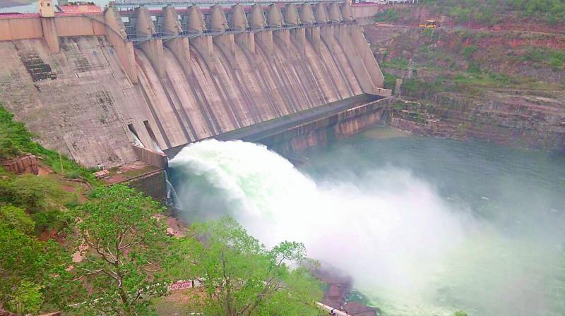 Water flows from Srisailam project after opening of a sluice gate. 2 TMC water released for drinking water purpose on Saturday. (Photo: DC) Water flows from Srisailam project after opening of a sluice gate. 2 TMC water released for drinking water purpose on Saturday. (Photo: DC)