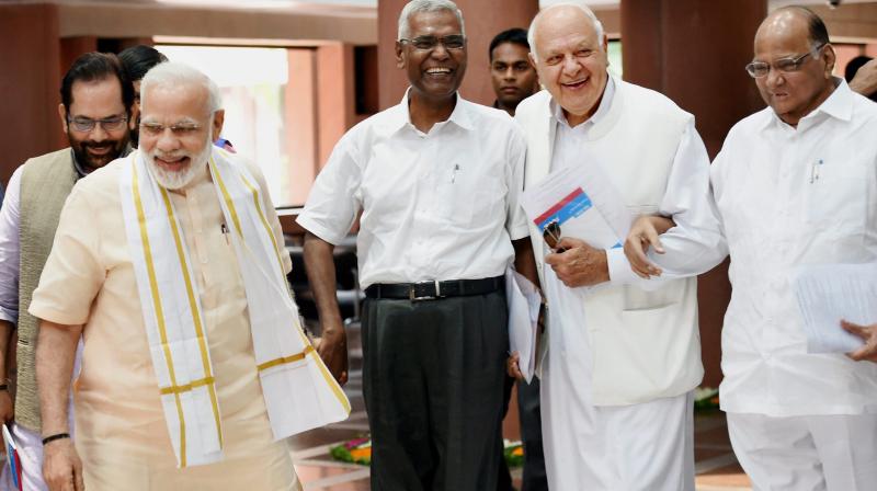 Prime Minister Narendra Modi with NCP chief Sharad Pawar, President of National Conference Farooq Abdullah and CPI's D Raja after an all-party meeting ahead of monsoon session of Parliament, in New Delhi on Sunday. (Photo: PTI) Prime Minister Narendra Modi with NCP chief Sharad Pawar, President of National Conference Farooq Abdullah and CPI's D Raja after an all-party meeting ahead of monsoon session of Parliament, in New Delhi on Sunday. (Photo: PTI)