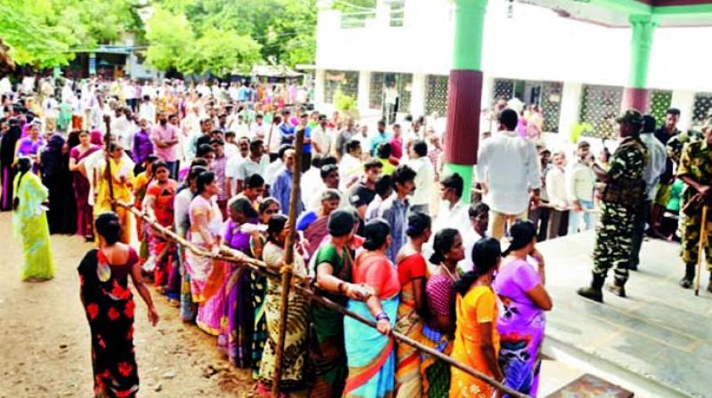 Voters in large numbers stand in queue to cast their vote at a polling booth in Nandyal on Wednesday. (Photo: DC) Voters in large numbers stand in queue to cast their vote at a polling booth in Nandyal on Wednesday. (Photo: DC)