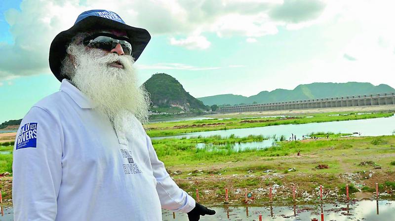 Founder of the Isha Foundation Jaggi Vasudev inspects the Krishnaveni pushkar ghat on Tuesday. Founder of the Isha Foundation Jaggi Vasudev inspects the Krishnaveni pushkar ghat on Tuesday.