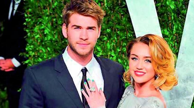 Liam Hemsworth and Miley Cyrus. Liam Hemsworth and Miley Cyrus.
