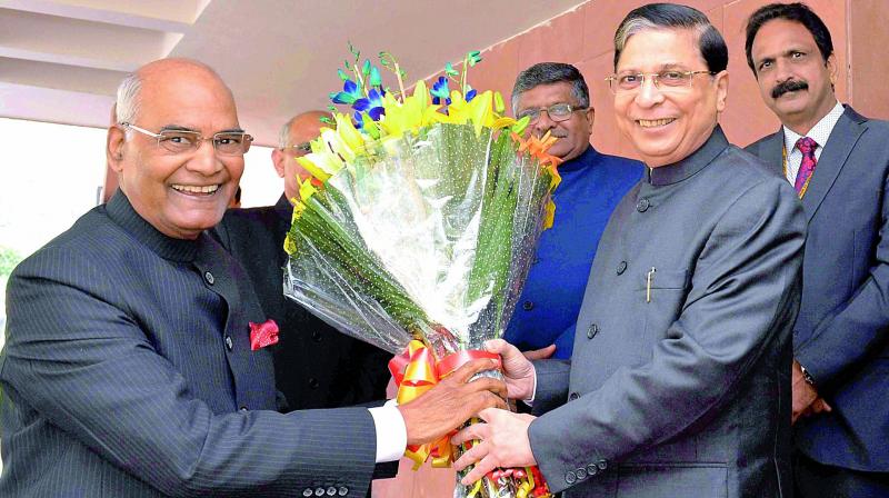 President Ram Nath Kovind being greeted by Chief Justice of India Justice Dipak Misra on Sunday. (Photo: PTI) President Ram Nath Kovind being greeted by Chief Justice of India Justice Dipak Misra on Sunday. (Photo: PTI)
