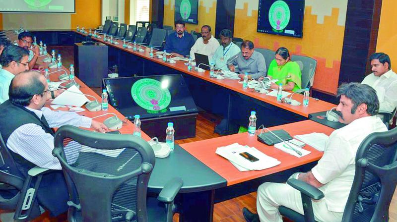 Actor-turned-politician and Hindupur MLA N. Balakrishna is sitting in CM’s chair while conducting meeting with officials on Lepakshi festival at CM’s camp office in Vijayawada on Wednesday. (Photo: PTI) Actor-turned-politician and Hindupur MLA N. Balakrishna is sitting in CM’s chair while conducting meeting with officials on Lepakshi festival at CM’s camp office in Vijayawada on Wednesday. (Photo: PTI)