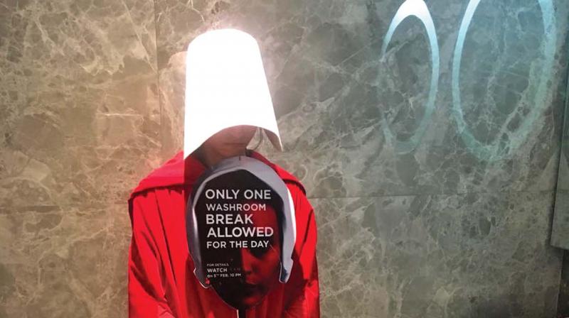A girl dressed as a handmaid holding a placard with a thought provoking message in Phoenix Mall, Chennai. A girl dressed as a handmaid holding a placard with a thought provoking message in Phoenix Mall, Chennai.