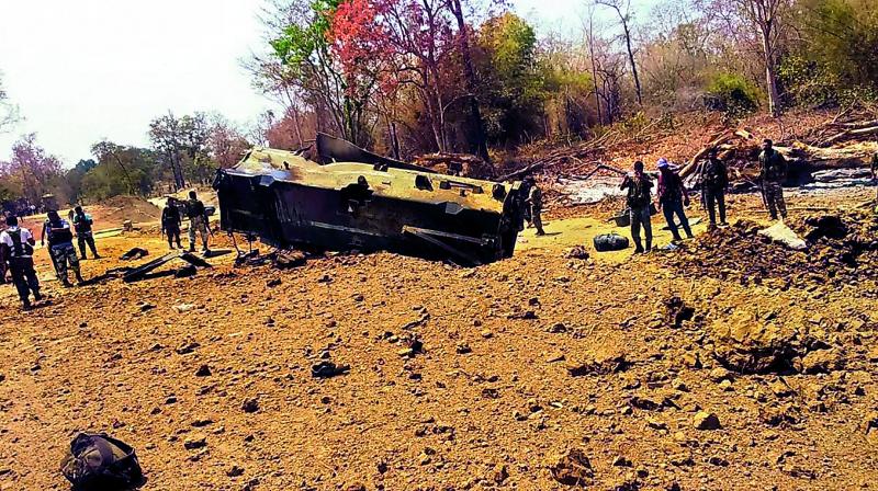Security personnel inspect the site of an IED blast in Kistaram area of Chhattisgarh’s Sukma district on Tuesday. — PTI Security personnel inspect the site of an IED blast in Kistaram area of Chhattisgarh’s Sukma district on Tuesday. — PTI
