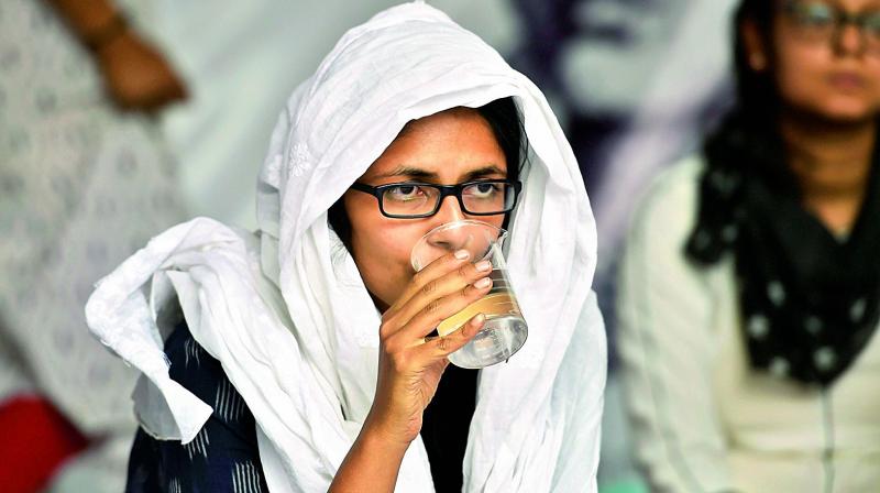 Delhi Commission for Women (DCW) Chief Swati Maliwal drinks water on the eight-day of her hunger strike against recent Unnao and Kathua rape cases in New Delhi, on Friday. (Photo: PTI) Delhi Commission for Women (DCW) Chief Swati Maliwal drinks water on the eight-day of her hunger strike against recent Unnao and Kathua rape cases in New Delhi, on Friday. (Photo: PTI)