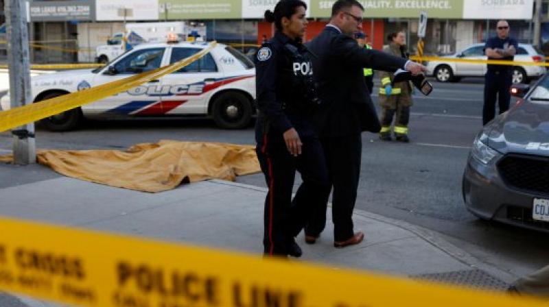 Toronto police investigates an incident where an van struck multiple people at a major intersection. (Reuters) Toronto police investigates an incident where an van struck multiple people at a major intersection. (Reuters)