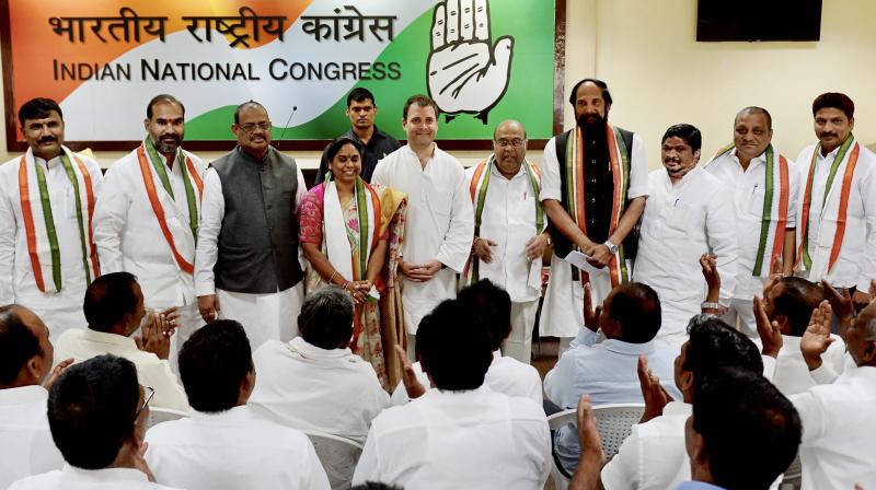 Congress president Rahul Gandhi with Dr. Nagam Janardhan Reddy, G Surya Kiran and other Telangana leaders who joined the party at the AICC headquarter in New Delhi on Wednesday. (Photo: PTI) Congress president Rahul Gandhi with Dr. Nagam Janardhan Reddy, G Surya Kiran and other Telangana leaders who joined the party at the AICC headquarter in New Delhi on Wednesday. (Photo: PTI)