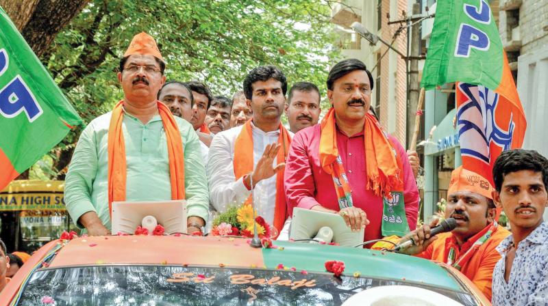 Tainted mining baron Janardhan Reddy joins BJP leader R. Ashok and candidate Lallesh Reddy in Bengaluru recently. Tainted mining baron Janardhan Reddy joins BJP leader R. Ashok and candidate Lallesh Reddy in Bengaluru recently.