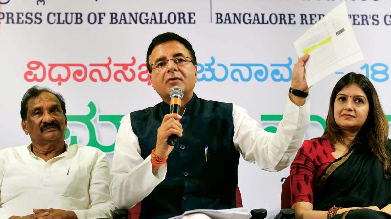 AICC's media in-charge Randeep Singh Surjewala addresses the media along with Bengaluru Development Minister K.J. George party and spokesperson Priyanka Chaturvedi in Bengaluru on Tuesday. AICC's media in-charge Randeep Singh Surjewala addresses the media along with Bengaluru Development Minister K.J. George party and spokesperson Priyanka Chaturvedi in Bengaluru on Tuesday.