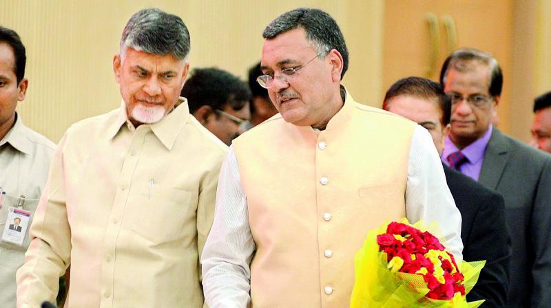 Chief Minister N. Chandrababu Naidu has a word with Chief secretary Dinesh Kumar on the first day of the collectors’ conference at Grievance Hall near Vijayawada on Tuesday. (Photo: DC) Chief Minister N. Chandrababu Naidu has a word with Chief secretary Dinesh Kumar on the first day of the collectors’ conference at Grievance Hall near Vijayawada on Tuesday. (Photo: DC)