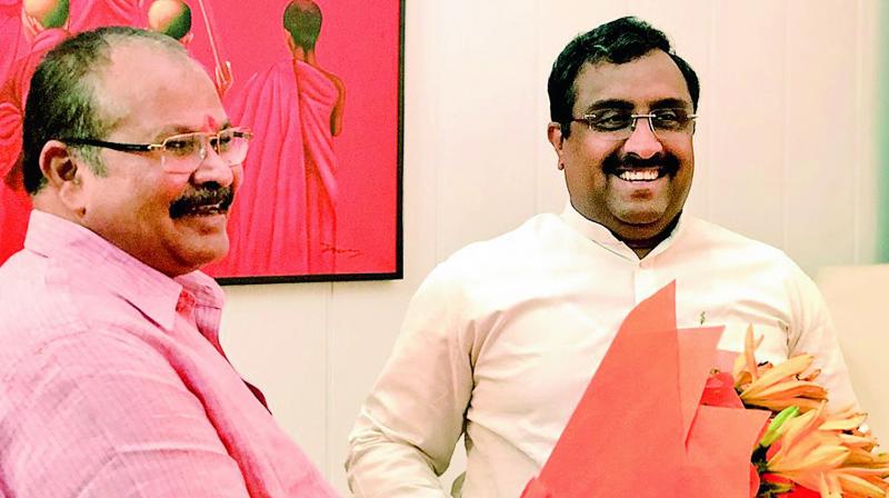 BJP Andhra Pradesh president Kanna Lakshminarayana meets party national general secretary and AP incharge Ram Madhav in New Delhi on Monday. BJP Andhra Pradesh president Kanna Lakshminarayana meets party national general secretary and AP incharge Ram Madhav in New Delhi on Monday.