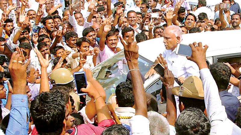 BJP workers greet former CM B.S. Yeddyurappa during his visit to Santebennur on Monday. (Photo: KPN) BJP workers greet former CM B.S. Yeddyurappa during his visit to Santebennur on Monday. (Photo: KPN)