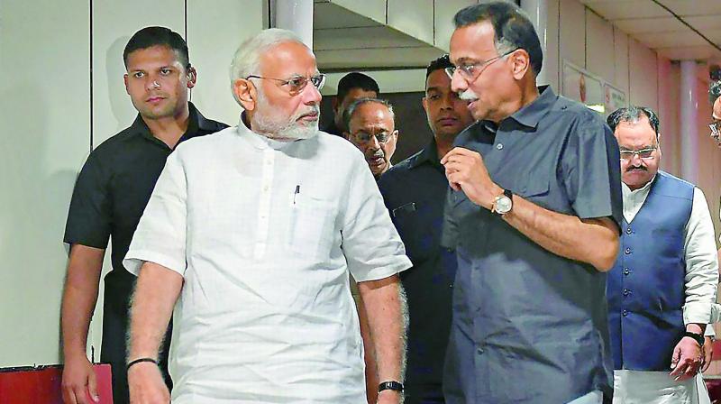 Prime Minister Narendra Modi talks to Ranjan Bhattacharya, the foster son-in-law of former prime minister Atal Behari Vajpayee, during his visit to AIIMS for a routine check-up, in New Delhi on Monday. (Photo: PTI) Prime Minister Narendra Modi talks to Ranjan Bhattacharya, the foster son-in-law of former prime minister Atal Behari Vajpayee, during his visit to AIIMS for a routine check-up, in New Delhi on Monday. (Photo: PTI)